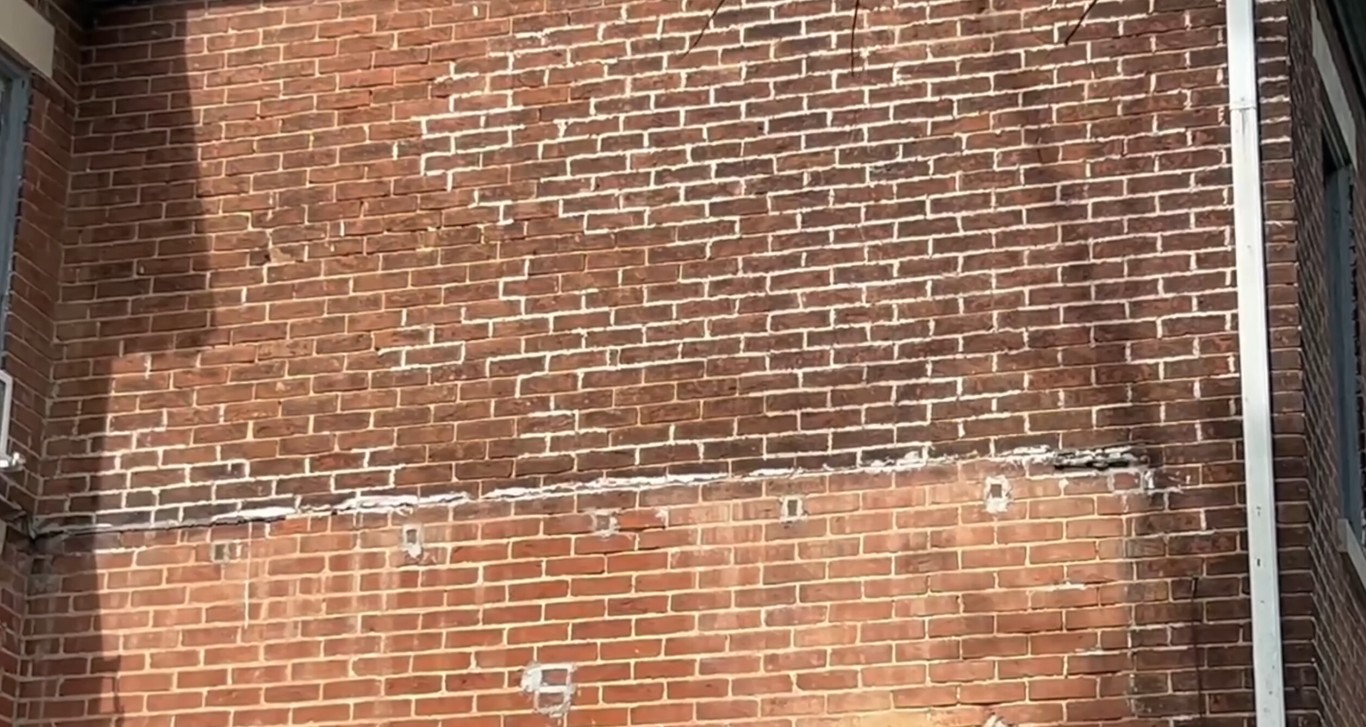 Professional brick repair and restoration services showing damaged mortar joints requiring tuckpointing in Menifee, CA